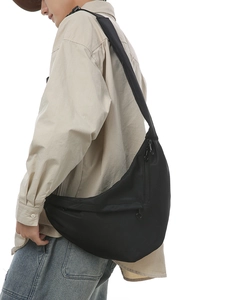 Minimalist black nylon half-moon crossbody bag for men and women in casual sporty style