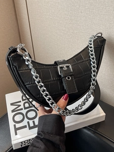 Chic black crescent underarm bag with crocodile texture and silver metal chain detail