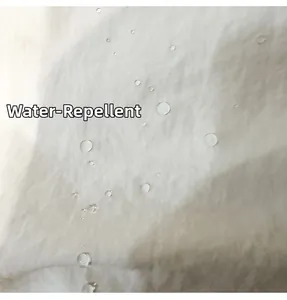 Close-up of white water-repellent nylon fabric with water drops on a tote bag