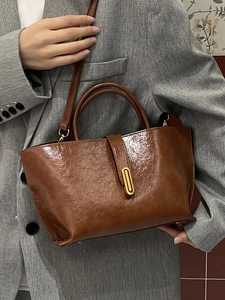 Classic brown oil wax leather bucket bag with gold hardware for women's daily commute