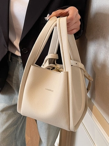 Chic off-white lychee texture leather bucket bag with top handles and adjustable strap