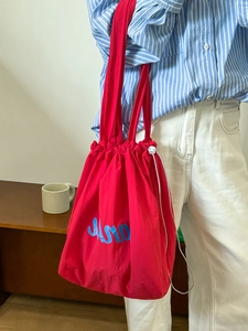 Large red nylon drawstring tote bag with Muro embroidery for casual commuting