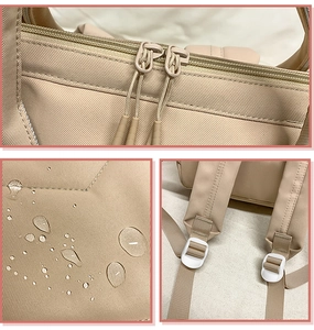 Détails du tissu en nylon imperméable avec gouttes d'eau et fermetures sur le sac à dos