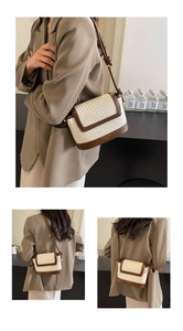 Détail du tissage contrasté et de la bordure en cuir marron sur le sac élégant