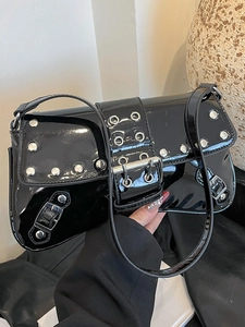 Punk style black patent leather shoulder bag with silver rivet details and metal eyelets