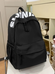 Minimalist black nylon backpack with white SINS lettering print for students and commuters