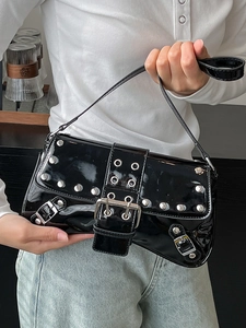 Punk style black patent leather shoulder bag with silver studs and metal eyelets