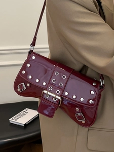 Punk style dark red patent leather shoulder bag with silver rivets and buckles