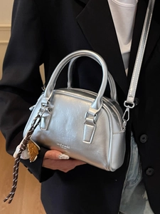 Silver metallic bowling handbag for women with top handles and adjustable shoulder strap