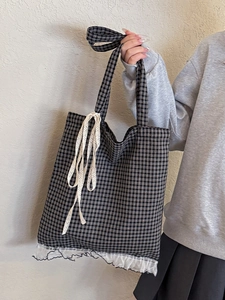 Black and white plaid tote bag with lace trim and ribbon bow for sweet casual style