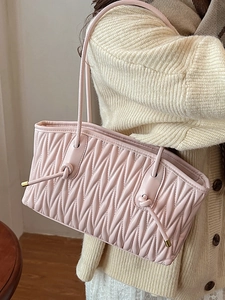 Pink Matelasse pleated tote bag with knot shoulder straps and gold metallic accents