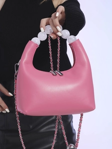 Pink minimalist crescent bag with decorative beaded handle and chain strap for women