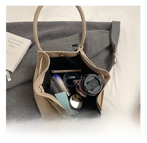 Detail view of the spacious inner compartment with magnetic closure on this tote bag