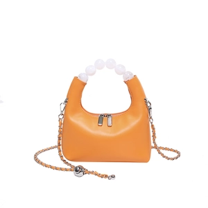Sac hobo orange en cuir avec poignée en perles et bandoulière en chaîne pour femmes