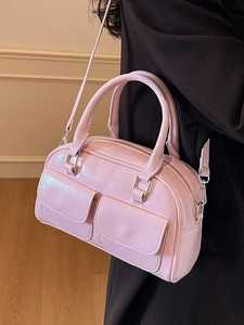 Glossy pink oil wax leather Boston handbag with front pockets and crossbody strap