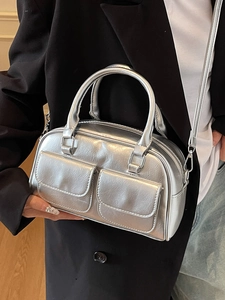 Chic silver Boston handbag with front buckle pockets and metallic finish for daily wear