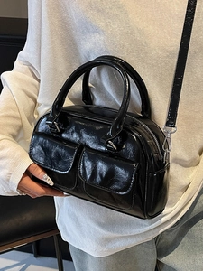 Minimalist black oil wax leather Boston bag with pleated texture and front pockets