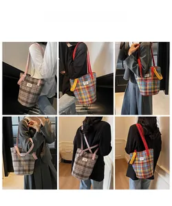 Detail showing the retro plaid canvas tote bag texture and textile label design
