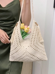 Artistic cream crochet woven tote bag with hollow patterns and long side tassels
