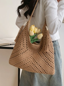 Brown crochet woven tote bag with long tassels and comfortable fabric lining for women