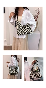 Close-up of handmade checkerboard knit shoulder bag with woven strap and tassel detail