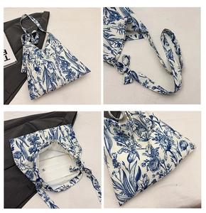 Detail view of floral tote bag with magnetic snap closure, lining, and inner zipper pocket