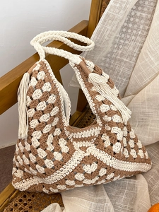 Bohemian crochet woven shoulder bag with brown geometric patterns and fringe details