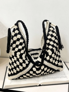 Handmade black and white checkered woven tote bag with fringe tassels and shoulder strap