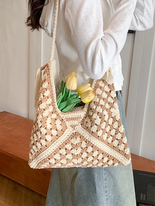Handmade crochet shoulder bag with beige and brown geometric knit patterns and tassels