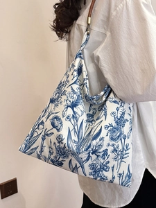 Large casual tote bag with blue botanical print and brown leather handles for women