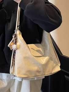 Retro minimalist cream faux leather hobo tote bag with a baseball charm for women