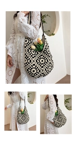 Close-up of black and white granny square crochet tote bag with handmade floral knit pattern