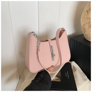 Close-up of pink woven texture shoulder bag with silver chain and metal lock detail