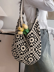 Ethnic style crochet tote bag with black and white granny square pattern for women