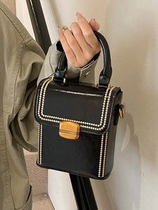 Chic black box handbag with contrast stitching and vintage gold buckle for women