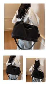 Detail showing high-capacity black nylon travel bag with leather trim and shoulder strap