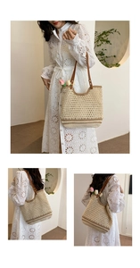 Detail of beige woven beach tote bag with brown leather handles and interior tulip flower
