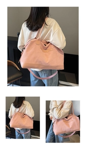 Detail view of pink large capacity tote bag featuring reinforced handles and adjustable strap