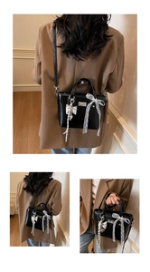 Detail showing back, side, and hand-carry views of a black oil wax leather bucket bag