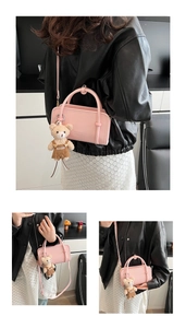 Close-up of pink PU leather handbag featuring a cute bear plush pendant and adjustable strap