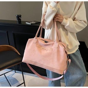 Detail of pink large travel tote bag with adjustable shoulder strap and NINGJIA logo