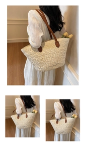 Detail of a large straw tote bag with brown leather handles in a chic beach style