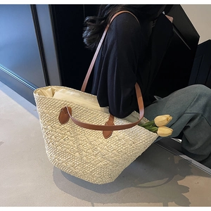 Large capacity straw tote bag with brown leather straps and white canvas inner lining
