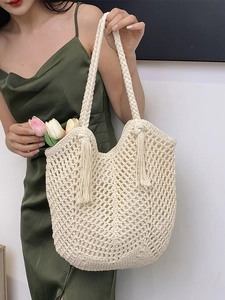 Handmade woven tote bag with fringe tassels and crochet hollow mesh for beach vacation