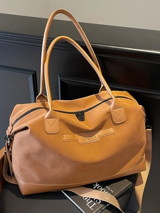 Large brown tote bag with adjustable shoulder strap and minimalist matte texture design