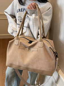 Fashionable large capacity beige tote bag for women with adjustable strap and top handle