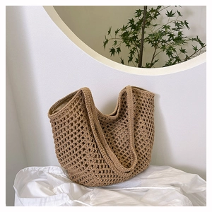 Detail of hand-woven hollow pattern on light brown tote bag with premium soft lining texture