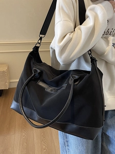 Minimalist black large capacity tote bag and travel bag for women with adjustable strap