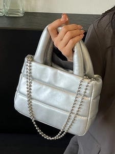 Quilted silver metallic bucket bag with bubble texture and ball chain strap for women