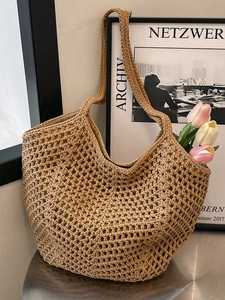 Handcrafted khaki straw woven tote bag with hollow mesh design for beach and casual style